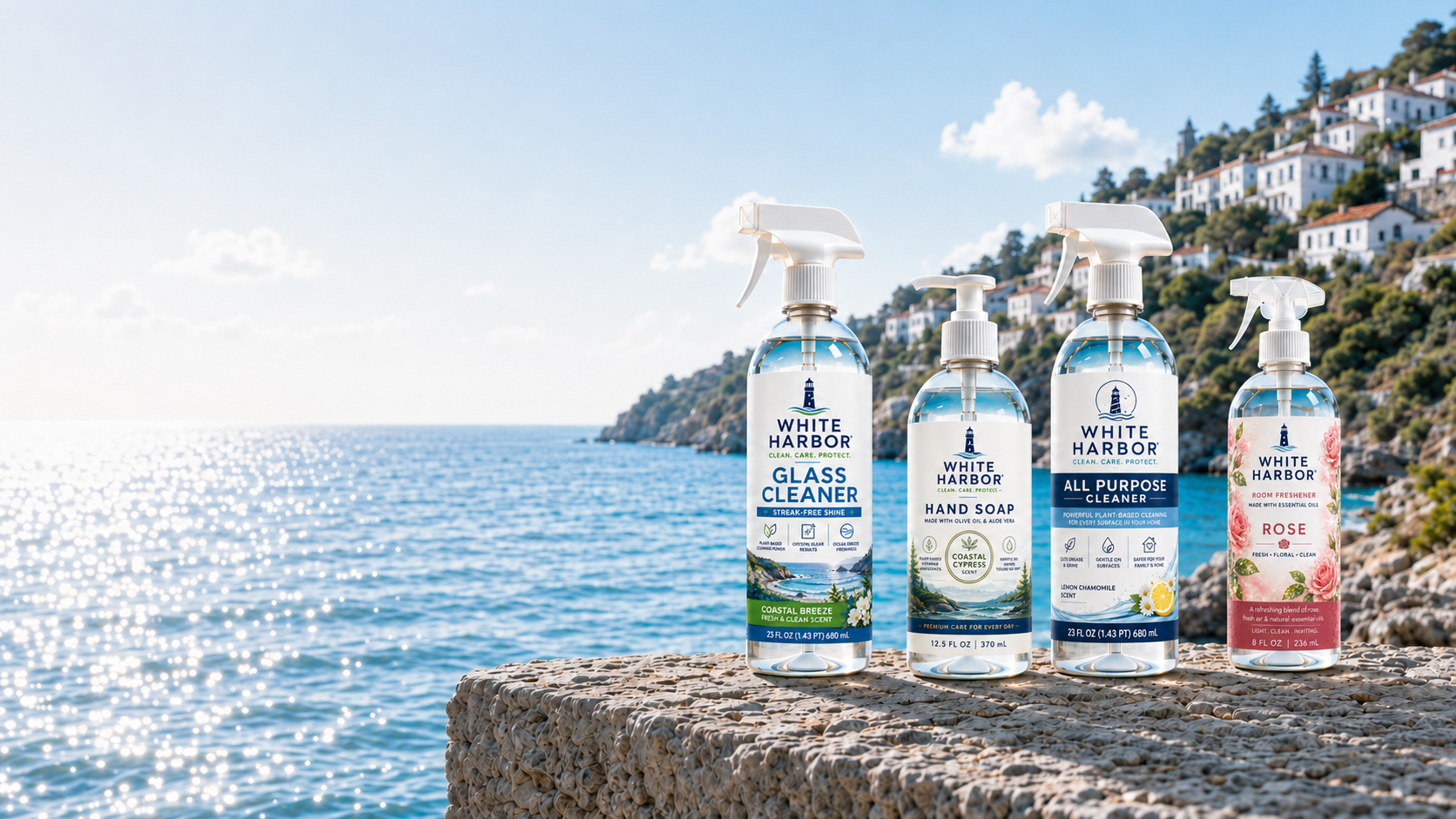 White Harbor product lineup on a stone ledge above the turquoise Adriatic sea